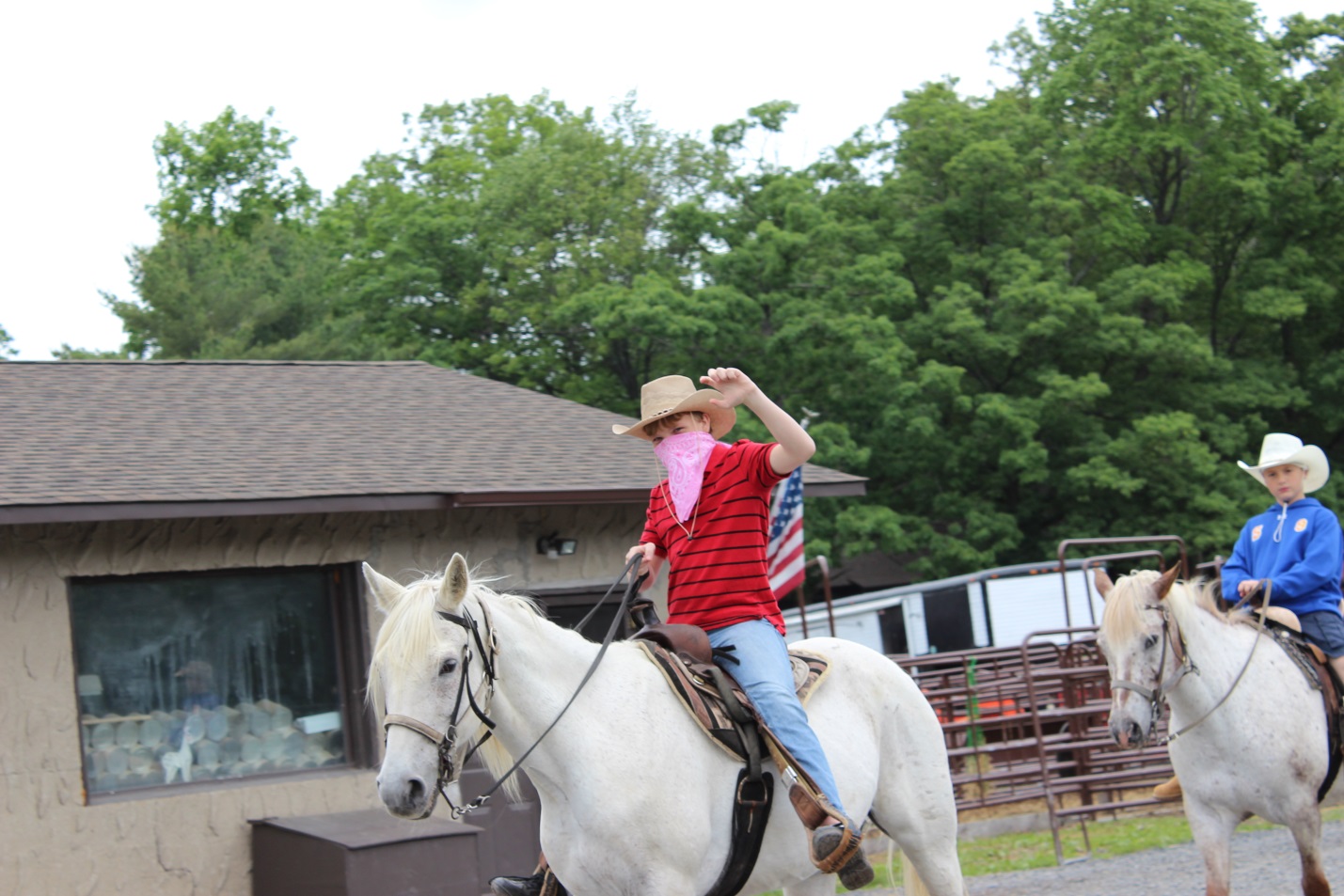 Myron rides a horse at the Healing Hearts Camp alt text